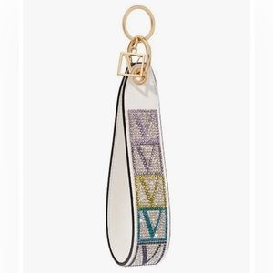 VICTORIA'S SECRET WHITE SHINE
V-MONOGRAM WRISTLET STRAP
KEYCHAIN